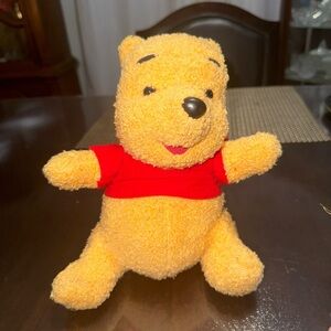 1998 Classic Winnie the Pooh push toy sings “up down touch the ground “